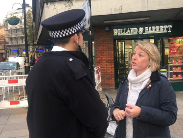 Nickie with a police officer